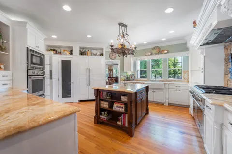 a living room with furniture ceiling fan and a rug