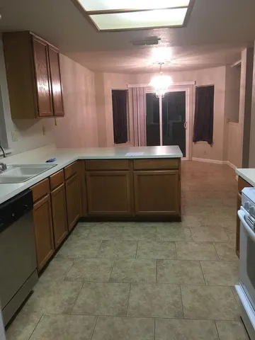 a spacious bathroom with a sink and mirror