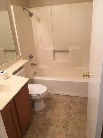 a bathroom with a toilet a sink and bathtub