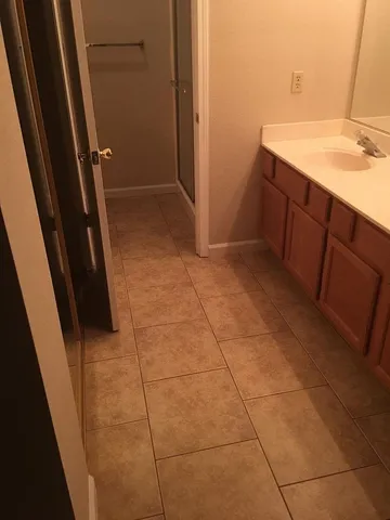 a bathroom with a sink a vanity and a mirror