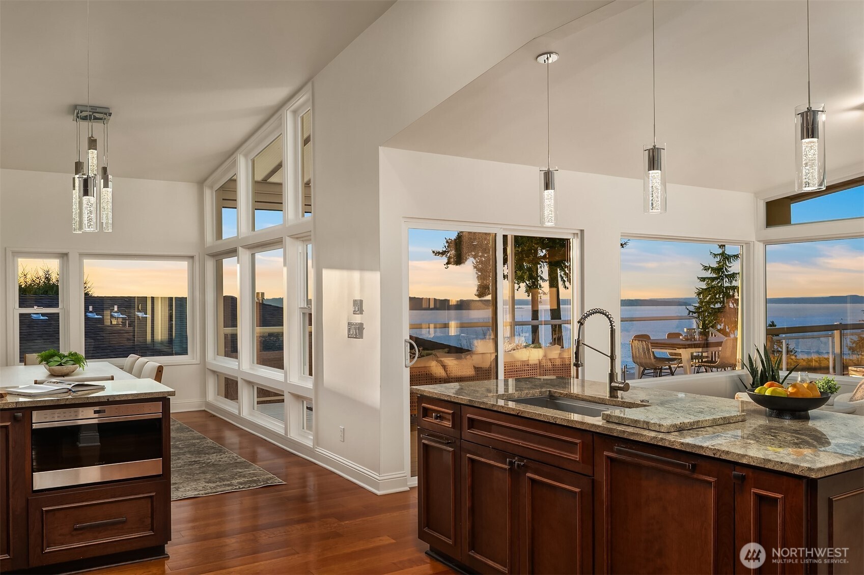 13621 18th Avenue Southwest Burien, WA 98166 - Photo 11 of 40 a kitchen with stainless steel appliances kitchen island granite countertop a sink and wooden cabinets