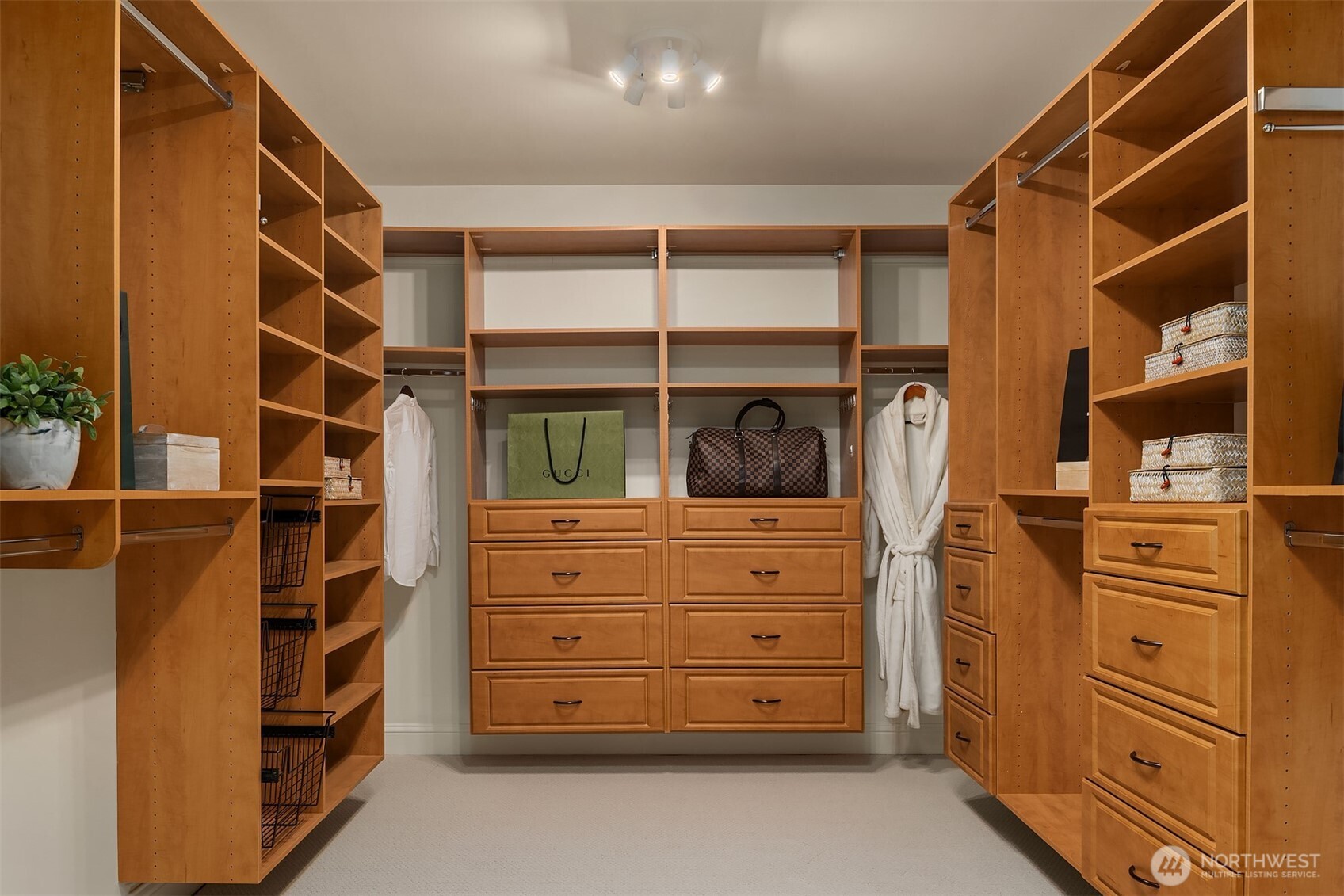 13621 18th Avenue Southwest Burien, WA 98166 - Photo 21 of 40 a view of walk in closet with clothes and shoes