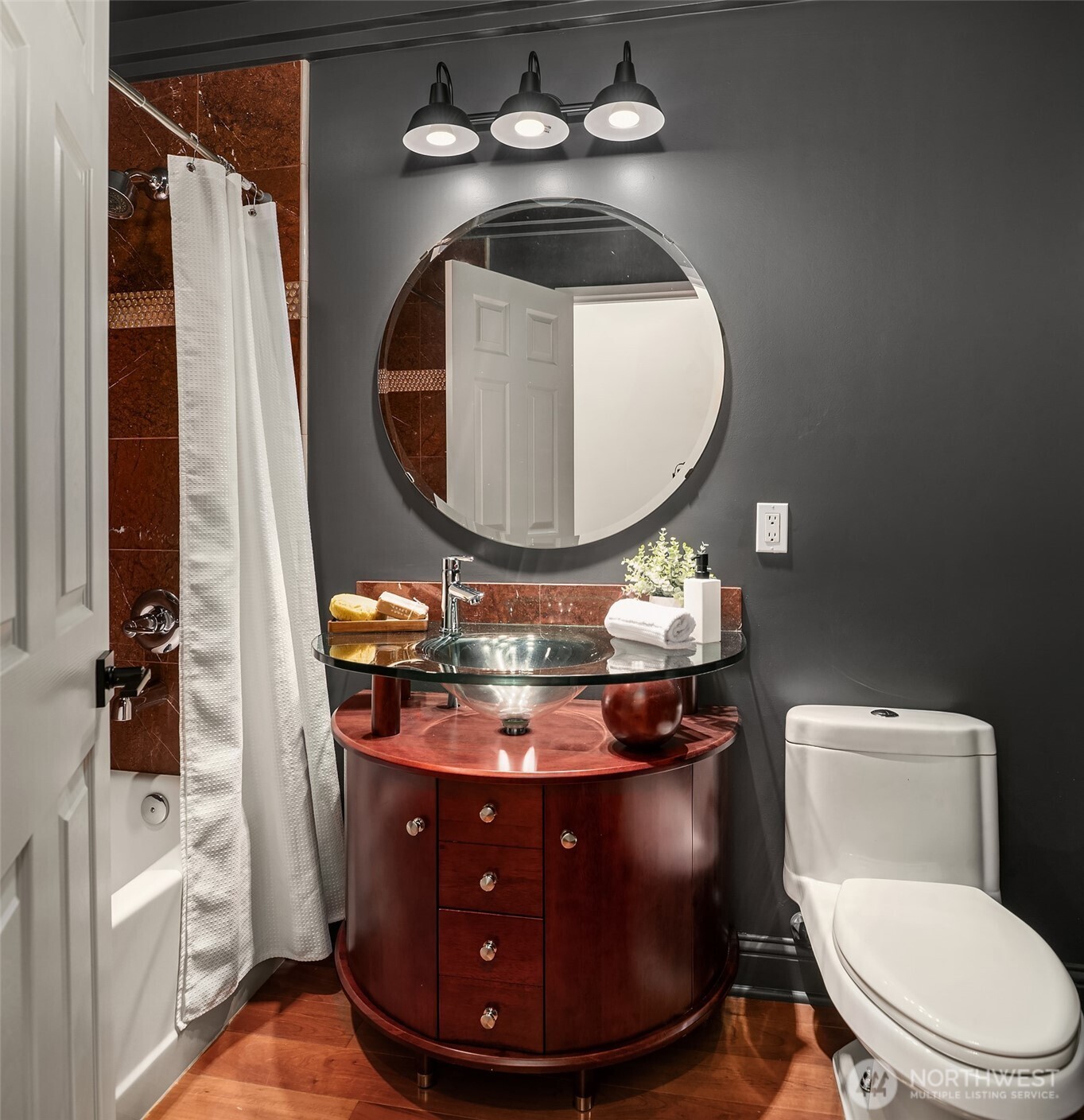 13621 18th Avenue Southwest Burien, WA 98166 - Photo 23 of 40 a bathroom with a toilet mirror and vanity