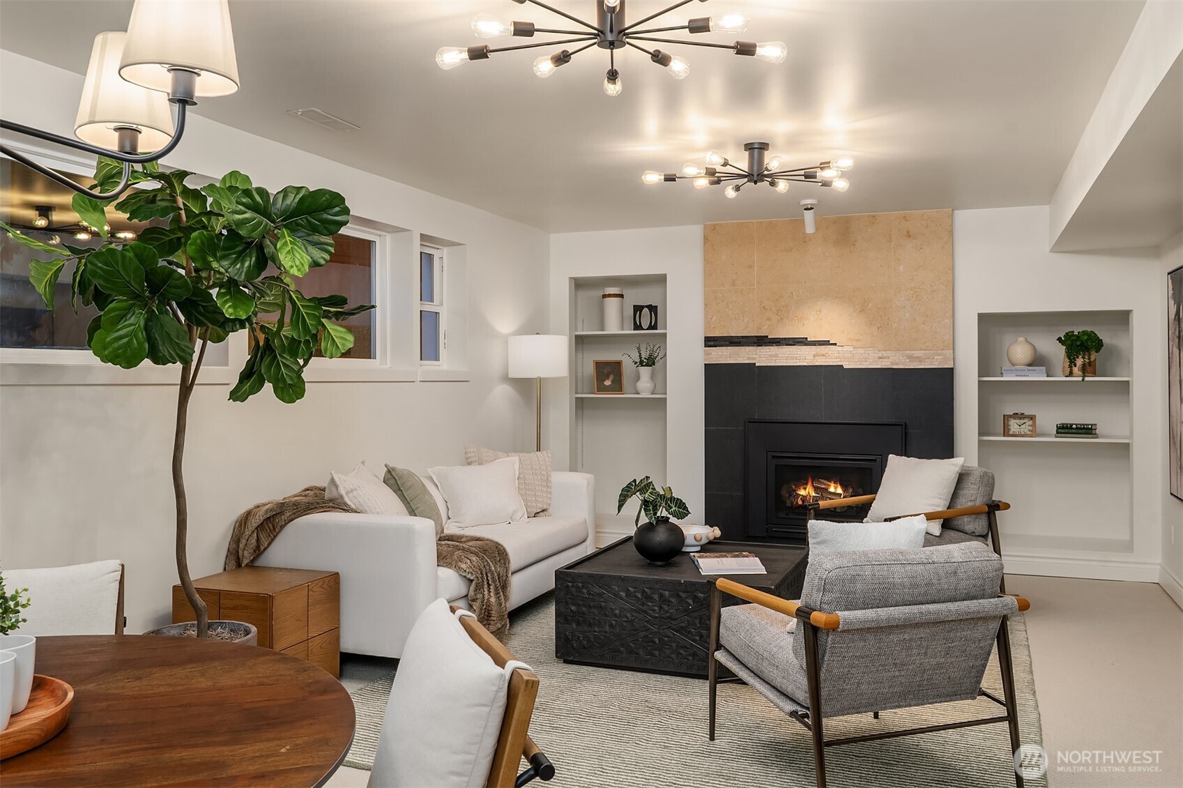 13621 18th Avenue Southwest Burien, WA 98166 - Photo 25 of 40 a living room with furniture a chandelier and a fireplace