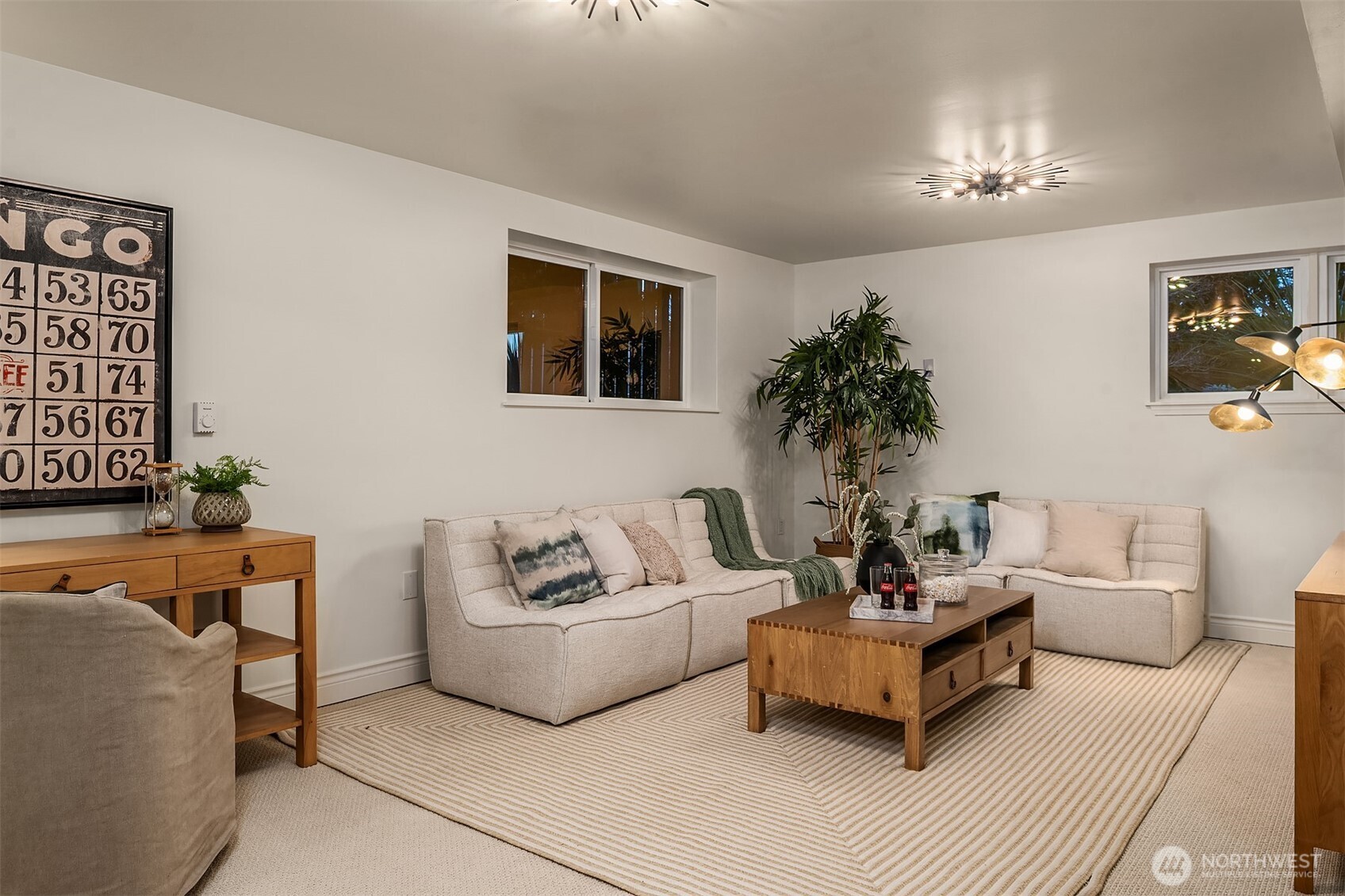 13621 18th Avenue Southwest Burien, WA 98166 - Photo 32 of 40 a living room with furniture and a chandelier