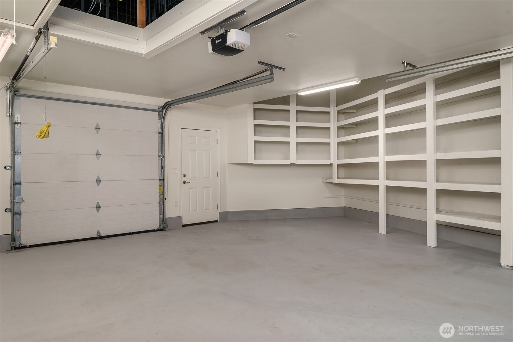 13621 18th Avenue Southwest Burien, WA 98166 - Photo 33 of 40 a view of an empty room with empty shelves