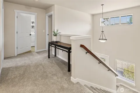 a view of a hallway with staircase