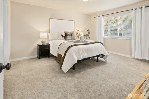 a bed room with a bed and a couch