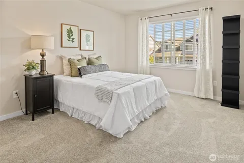 a bed room with a bed and a tv