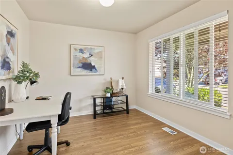 a dining room with furniture and window