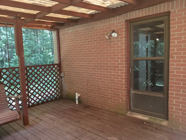 a view of a brick house with wooden floor