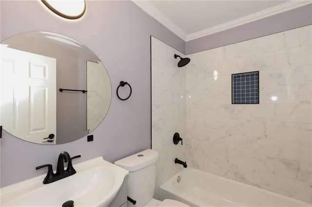 a bathroom with a sink a toilet and a bathtub