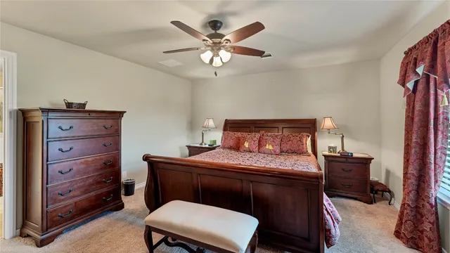 a bedroom with a bed and a dresser