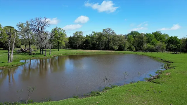 a view of a lake with a yard