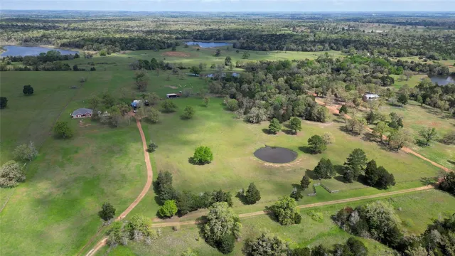 an aerial view of a residential houses with outdoor space