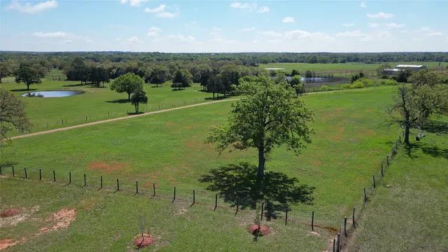 a view of a lake with a yard
