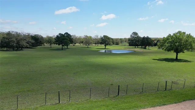 a view of a golf course with a lake