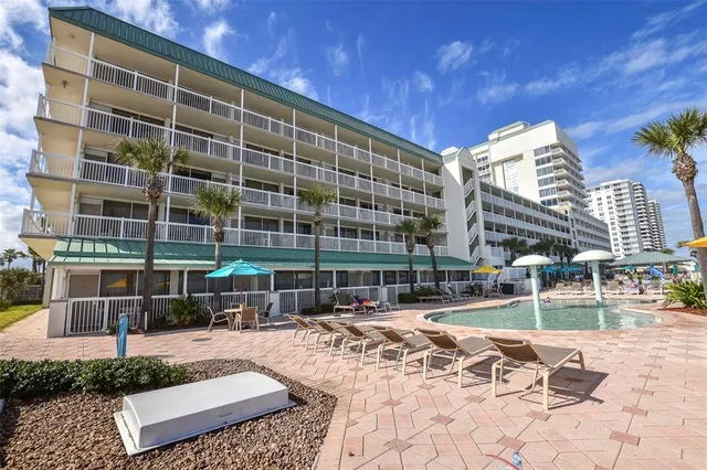 a view of swimming pool with a yard