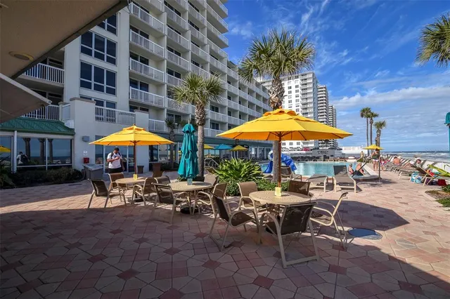 a view of a swimming pool with a patio