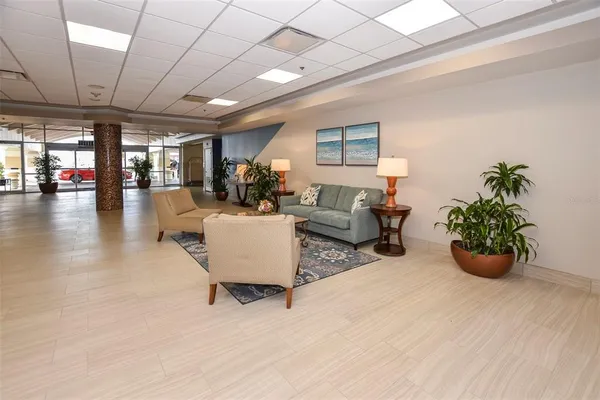 a front view of a building with a garden