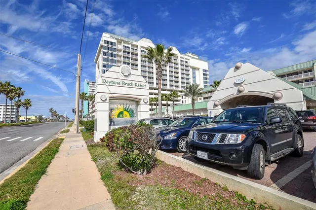 a reading room with wooden floor and furniture