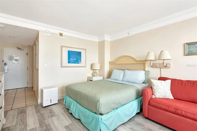 a bedroom with a bed and a couch