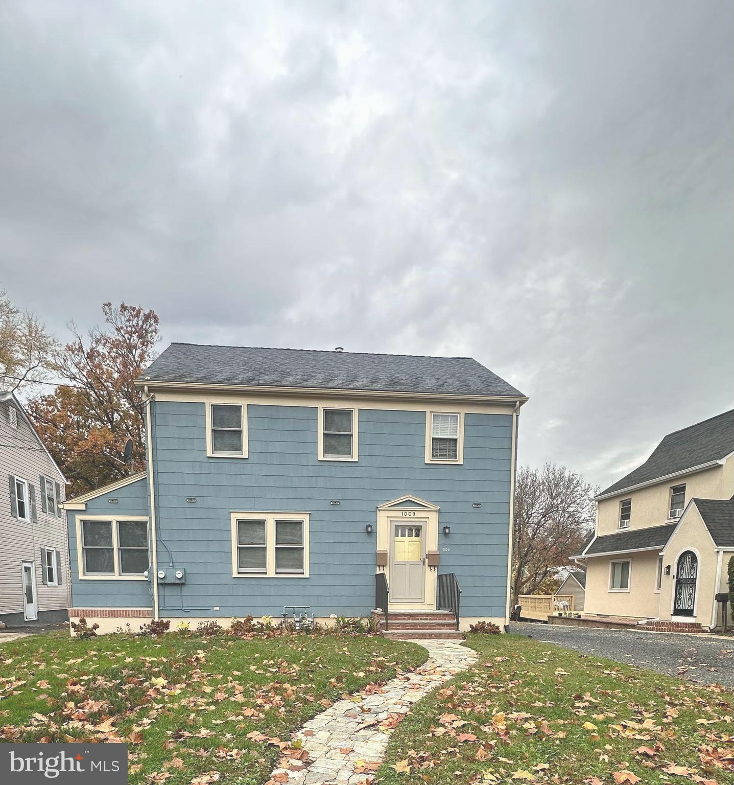 1009 Parkside Avenue, Unit 2 Ewing, NJ 08618 - Photo 1 of 23 front view of a house with a yard