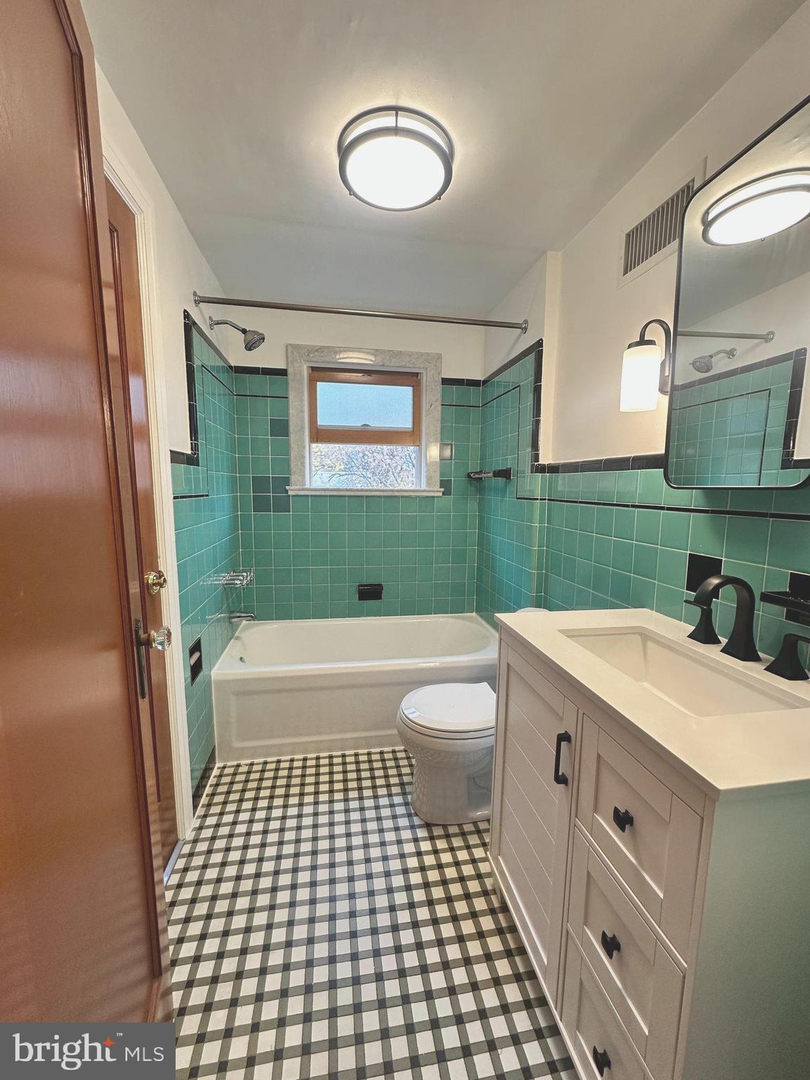 1009 Parkside Avenue, Unit 2 Ewing, NJ 08618 - Photo 12 of 23 a bathroom with a sink a toilet and a shower