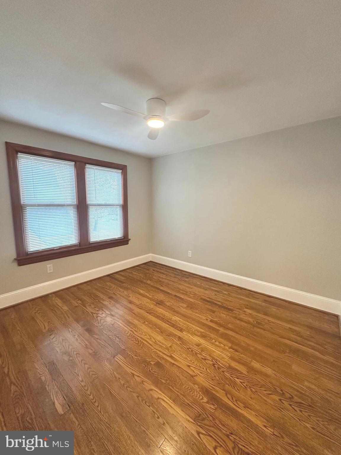 1009 Parkside Avenue, Unit 2 Ewing, NJ 08618 - Photo 14 of 23 wooden floor in an empty room with a window