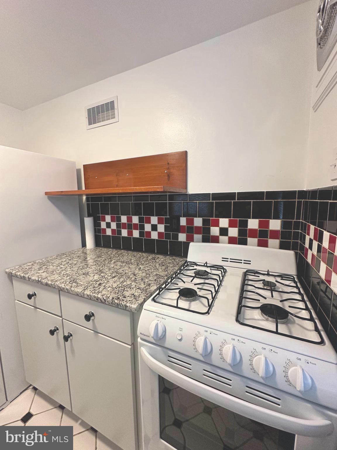 1009 Parkside Avenue, Unit 2 Ewing, NJ 08618 - Photo 18 of 23 a kitchen with a stove and a microwave