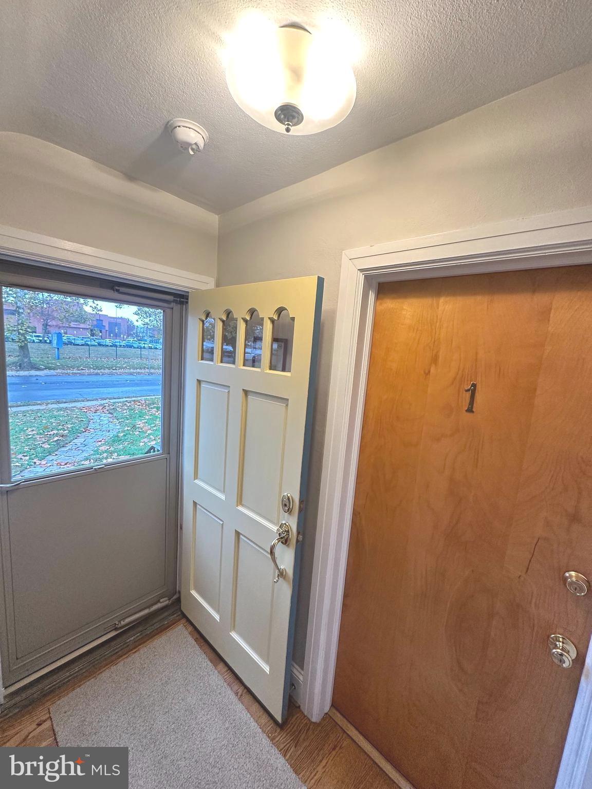 1009 Parkside Avenue, Unit 2 Ewing, NJ 08618 - Photo 2 of 23 an empty room with windows