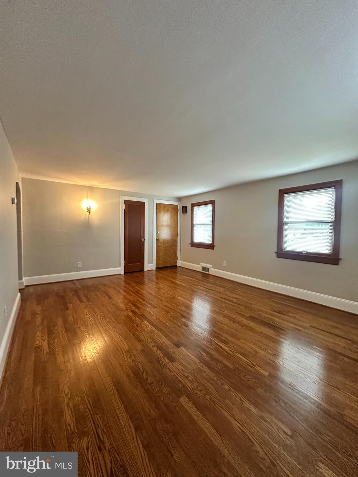 1009 Parkside Avenue, Unit 2 Ewing, NJ 08618 - Photo 6 of 23 a view of a livingroom with wooden floor and window