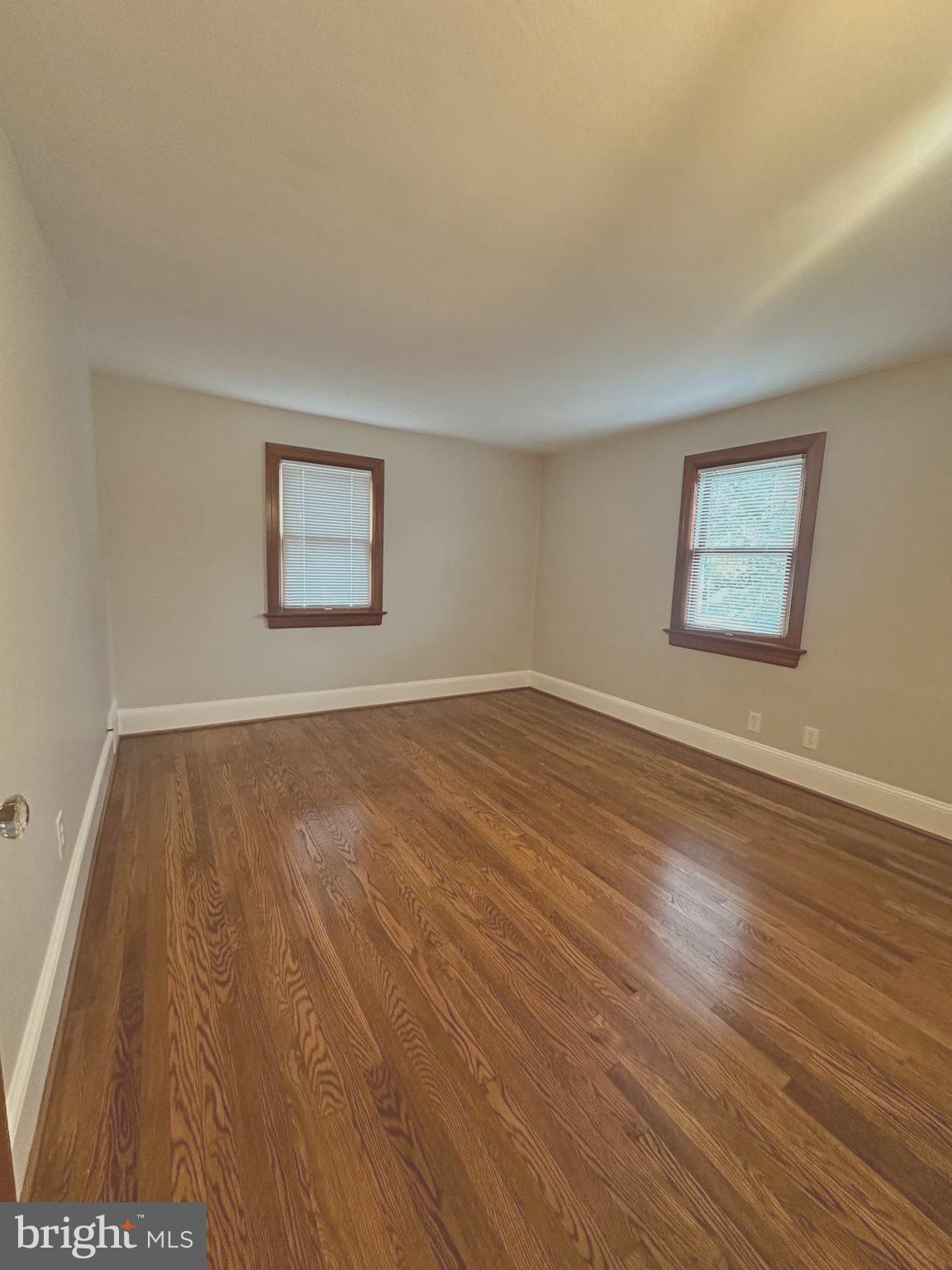 1009 Parkside Avenue, Unit 2 Ewing, NJ 08618 - Photo 8 of 23 a view of a room with wooden floor and window