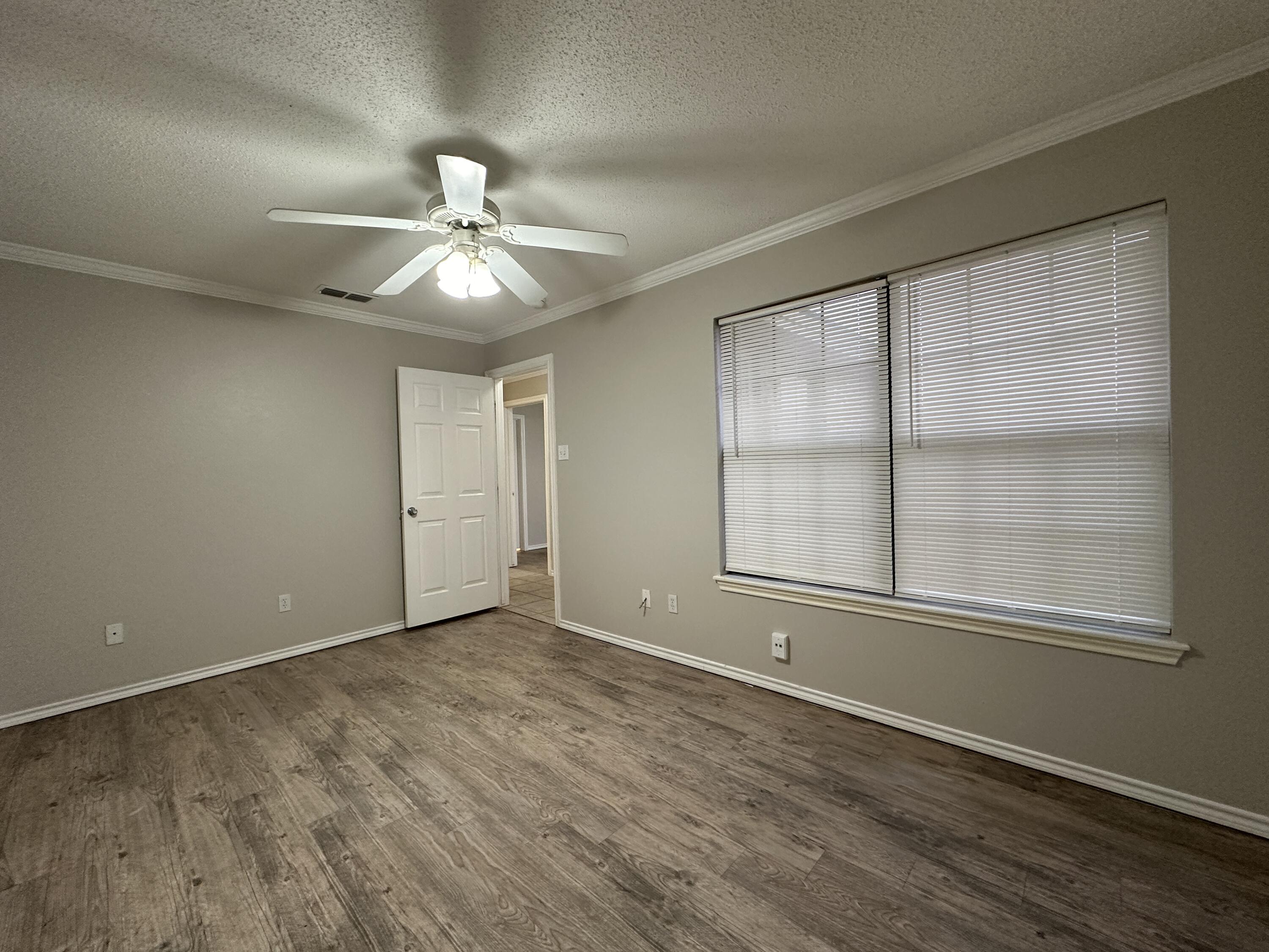 615 North Elkhart Avenue Lubbock, TX 79416 - Photo 13 of 15 a view of an empty room with a window