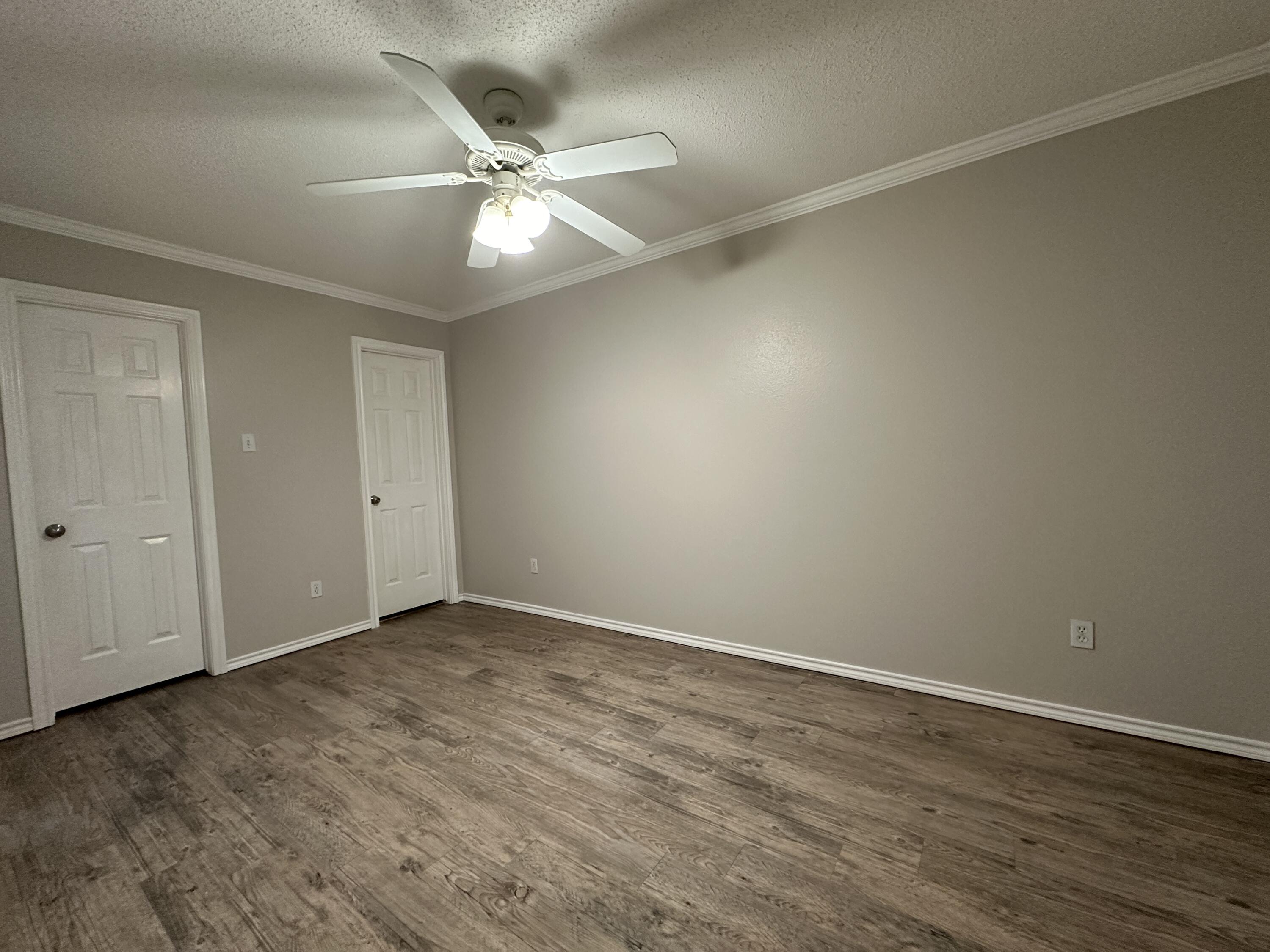 615 North Elkhart Avenue Lubbock, TX 79416 - Photo 14 of 15 a view of an empty room with wooden floor