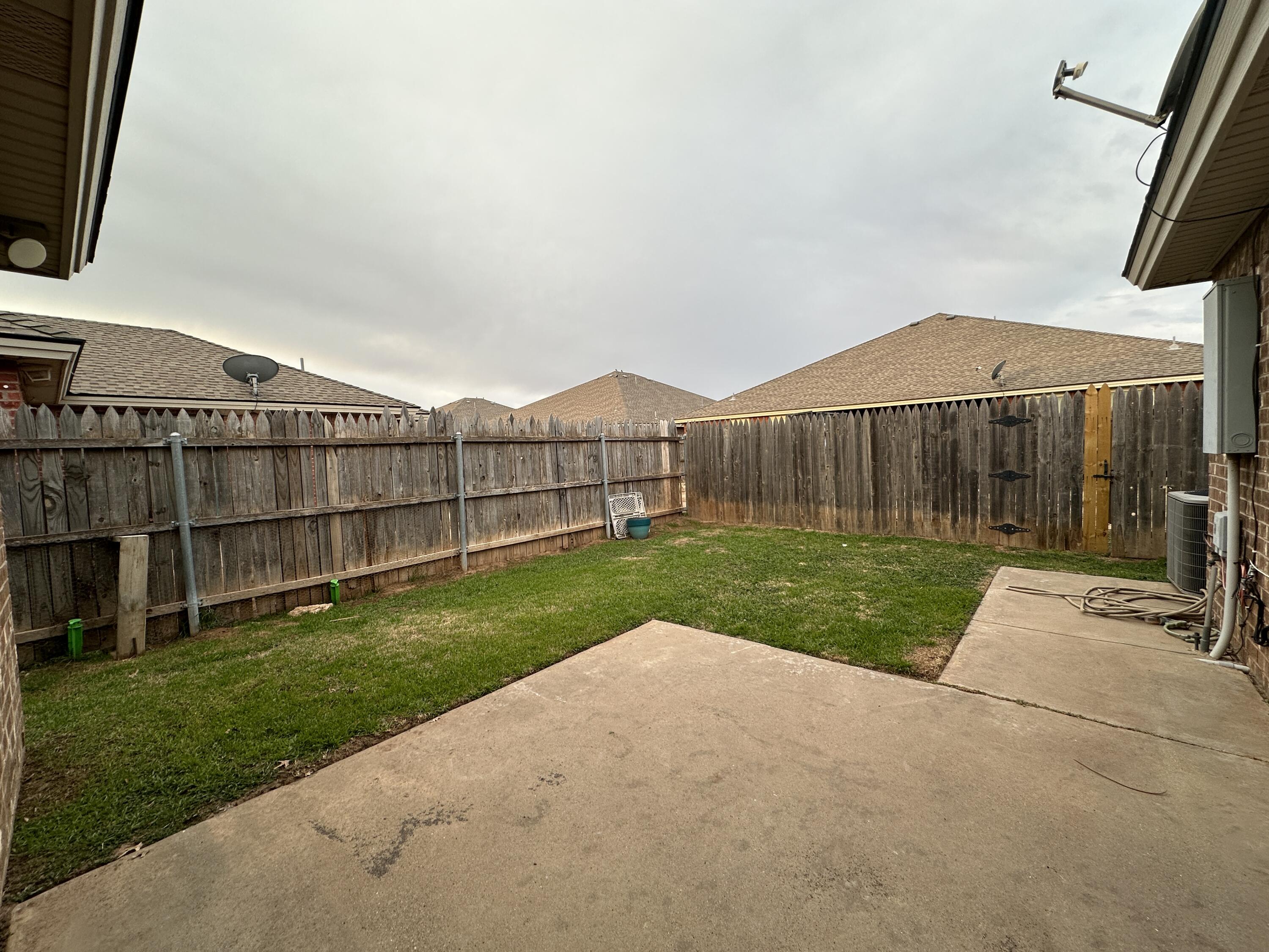 615 North Elkhart Avenue Lubbock, TX 79416 - Photo 15 of 15 a view of a house with a yard and pathway