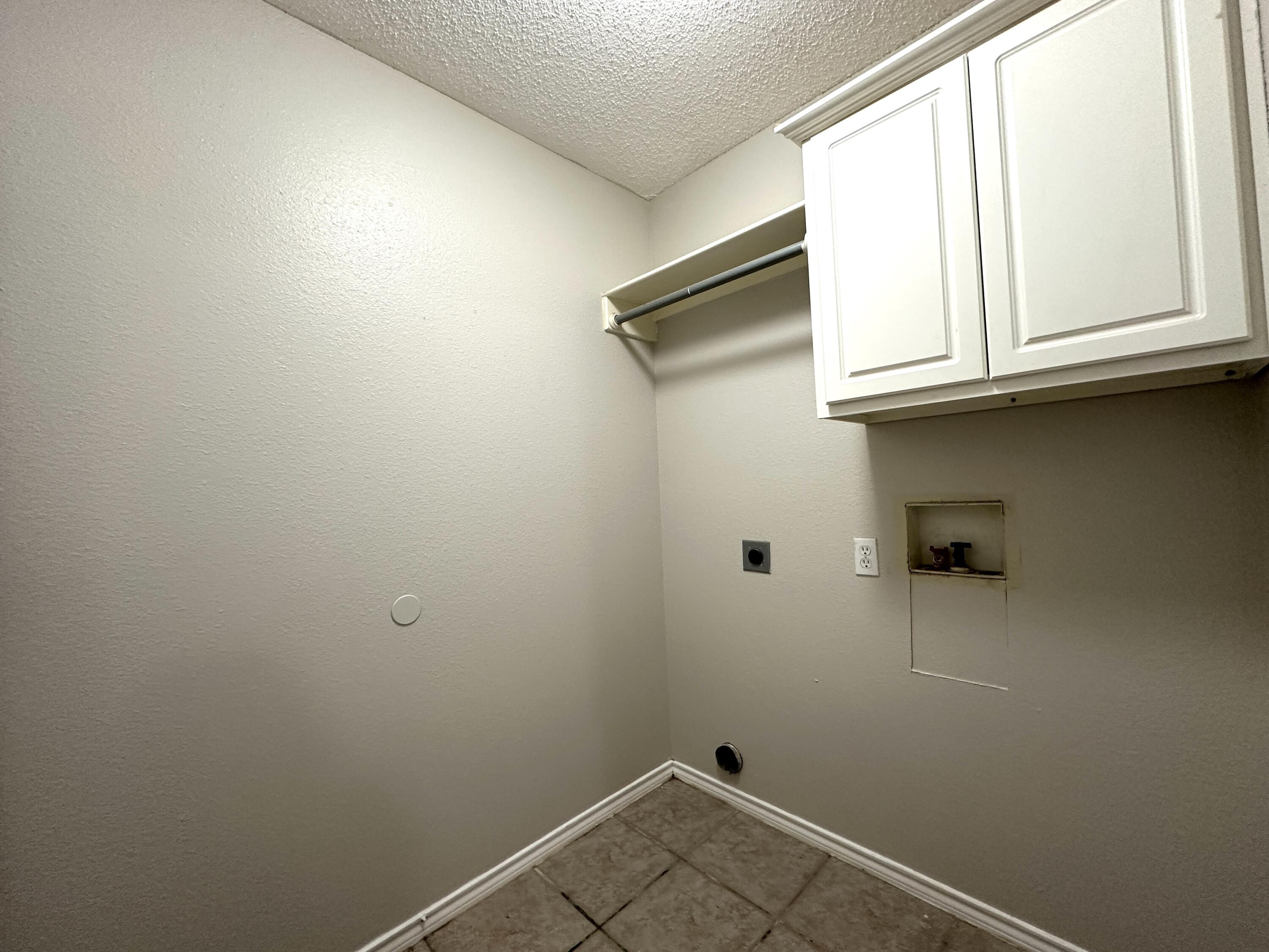 615 North Elkhart Avenue Lubbock, TX 79416 - Photo 8 of 15 a view of a closet area with wooden floor