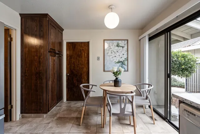a view of a dining room with furniture window and outside view