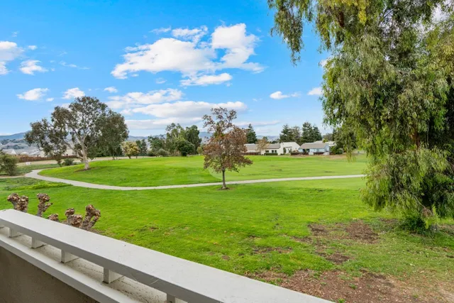 a view of a golf course with a lake