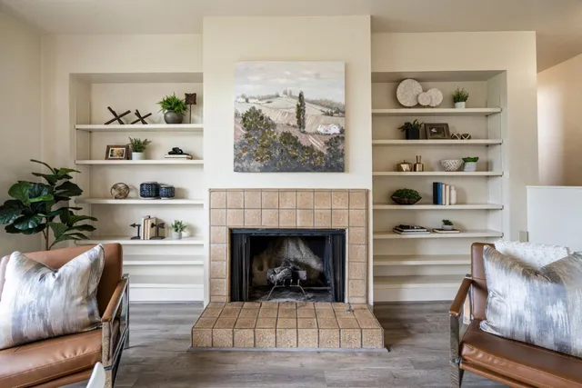 a living room with furniture and a fireplace