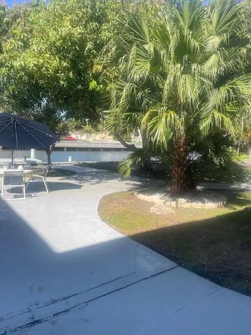 a view of a swimming pool with an outdoor space