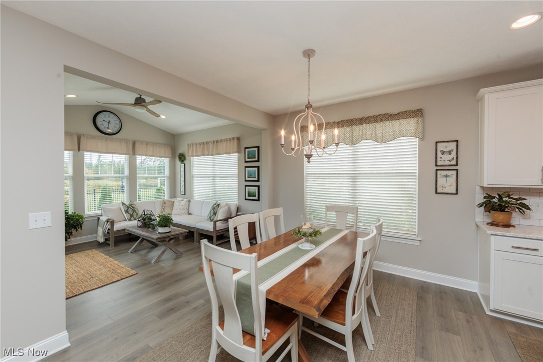 2041 Jaycox Road Avon, OH 44011 - Photo 24 of 50 Dining space featuring vaulted ceiling, plenty of natural light, recessed lighting, light wood-style floors, and a chandelier