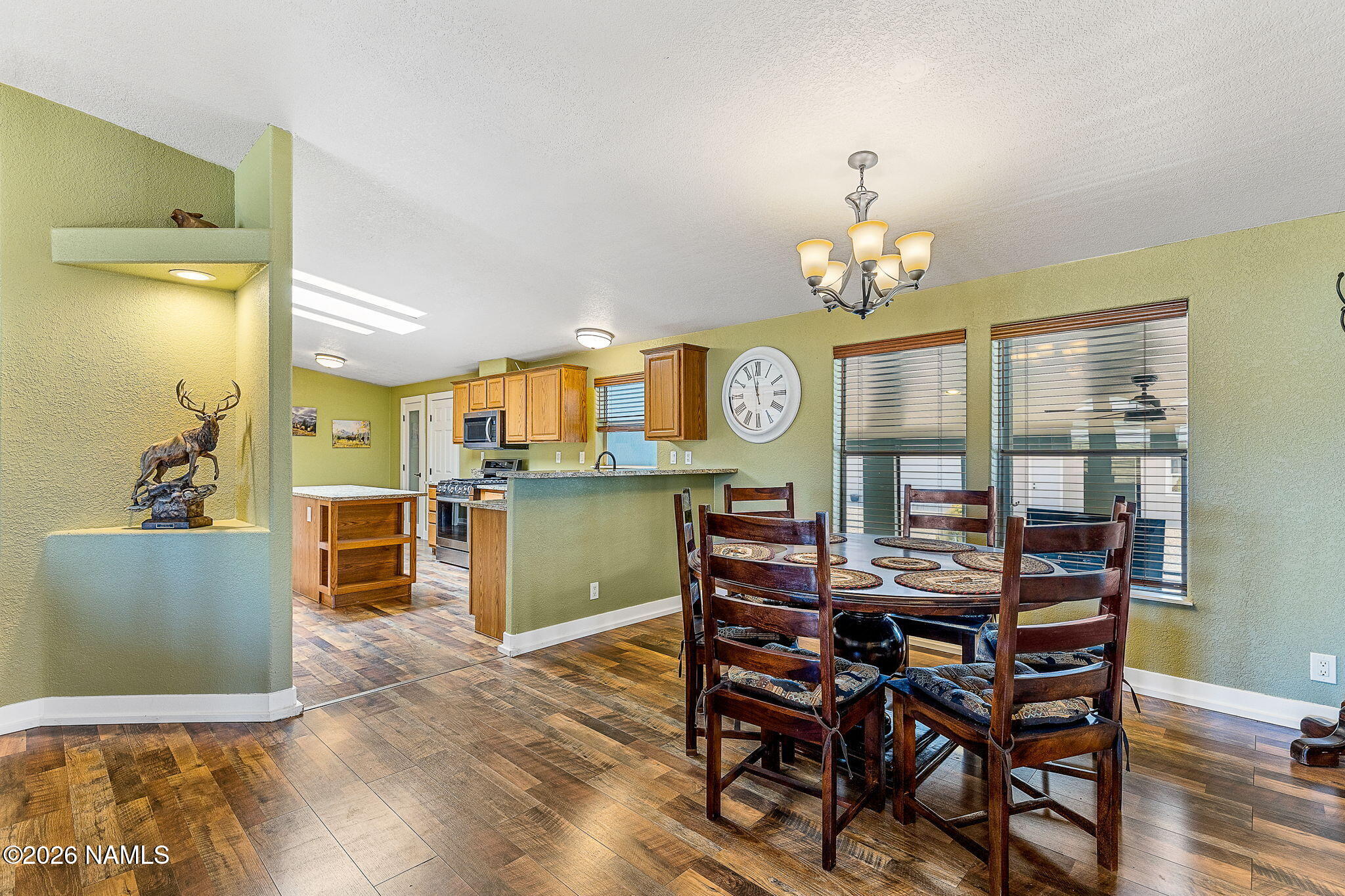 2318 Hoctor Road Williams, AZ 86046 - Photo 11 of 36 a view of a dining room with furniture and chandelier