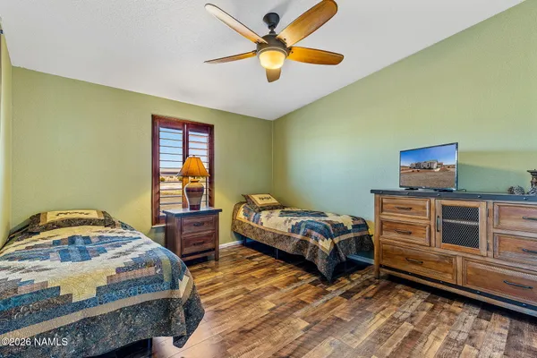 a bedroom with bed and a window