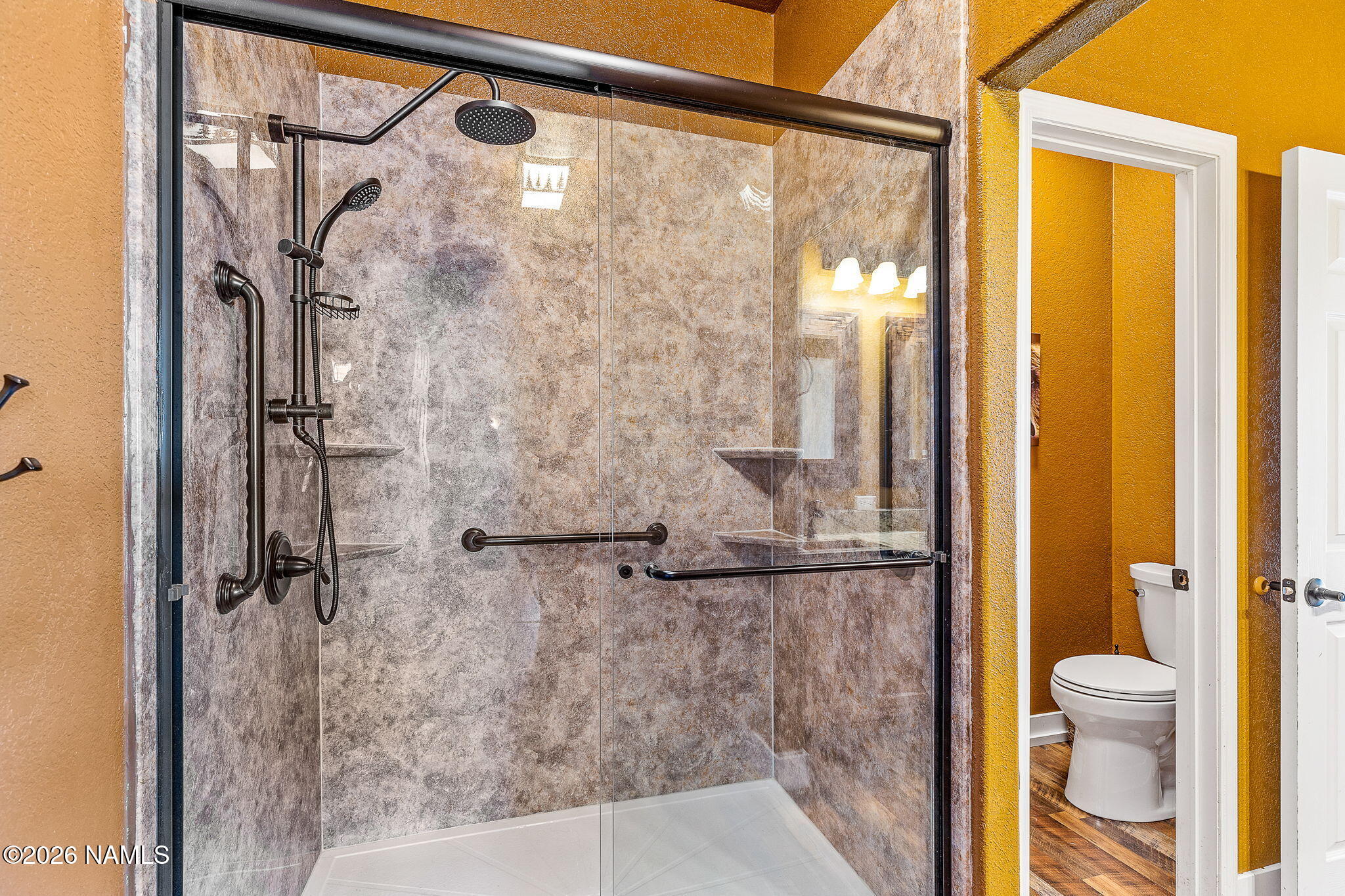 2318 Hoctor Road Williams, AZ 86046 - Photo 23 of 36 a bathroom with a glass shower door