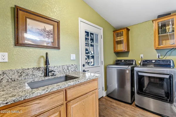 a kitchen with a stove and a sink