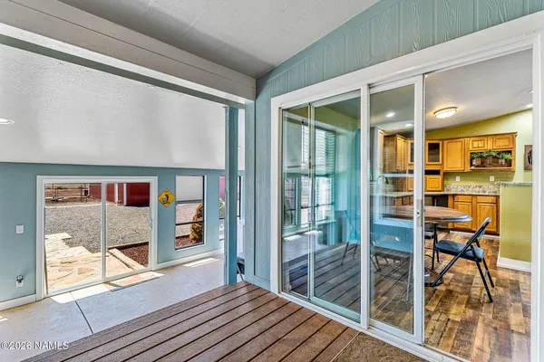 a view of a room with furniture and window