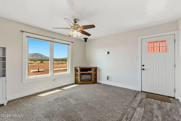 a view of an empty room with a window