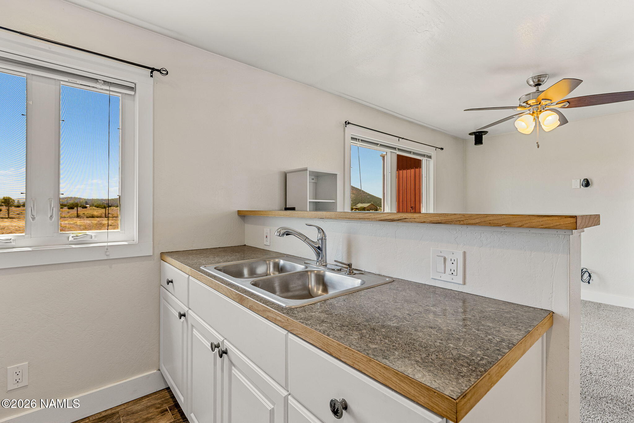 2318 Hoctor Road Williams, AZ 86046 - Photo 30 of 36 a kitchen with stainless steel appliances granite countertop a sink stove and cabinets