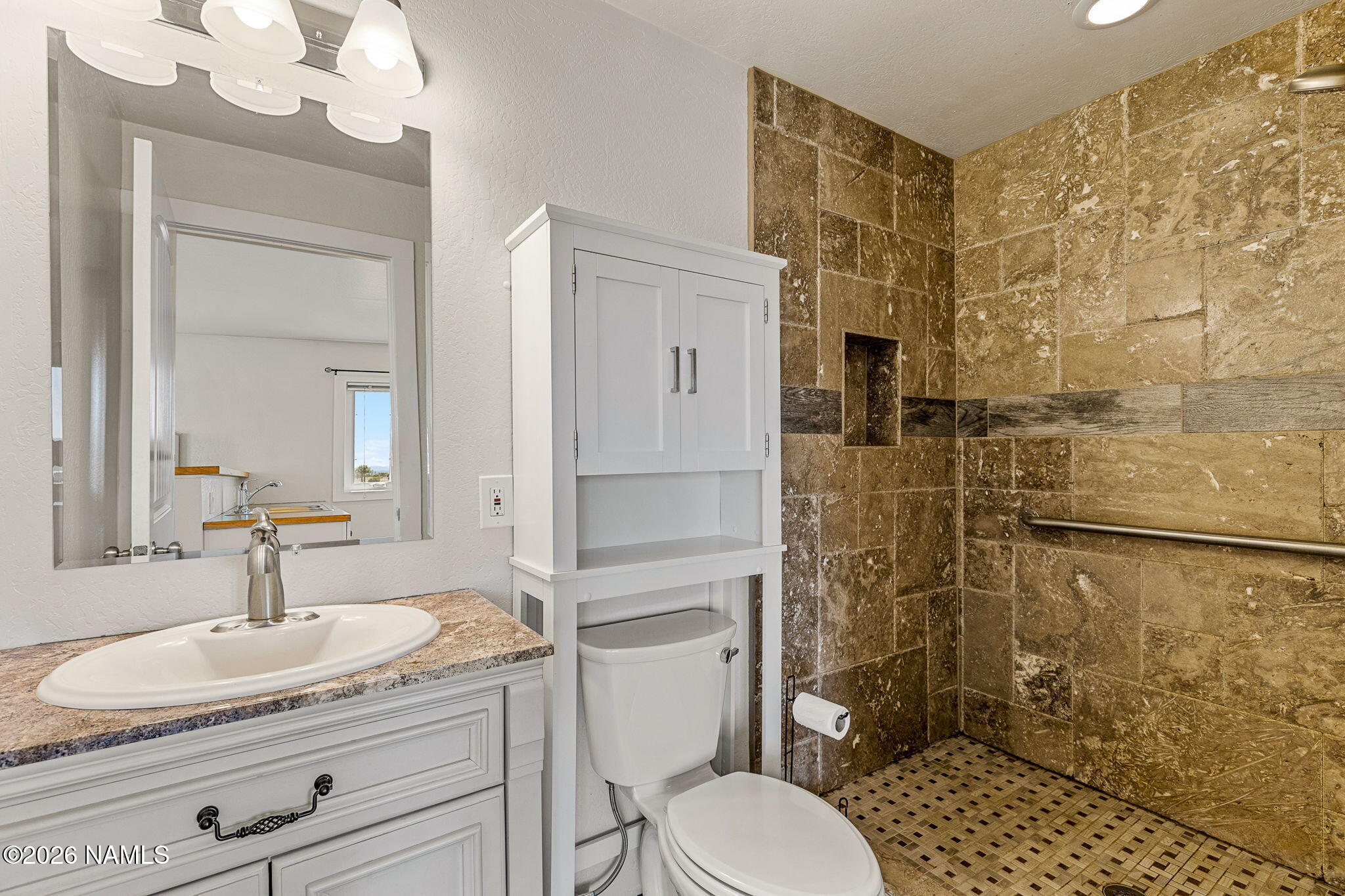 2318 Hoctor Road Williams, AZ 86046 - Photo 33 of 36 a bathroom with a granite countertop sink a toilet and shower